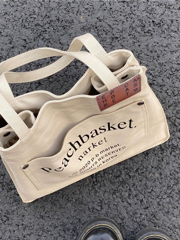 Tragetasche aus Canvas mit großem Fassungsvermögen und Buchstabendruck-4